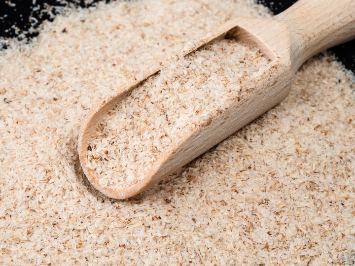 Wooden Scoop in Psyllium Husk Close up
