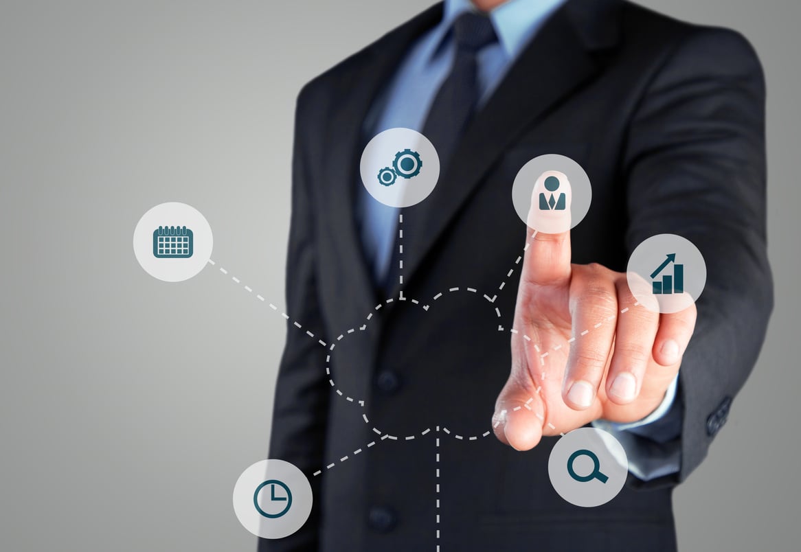 Businessman selecting outsource button on virtual screen